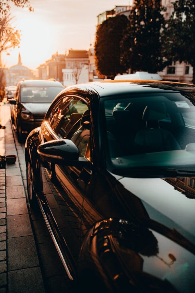 A sleek black car parked on an Istanbul street, captured at sunset with a warm, urban ambiance.
